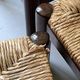 Lot of 4 modernist chairs in solid wood, leather and straw, Italy 1970.