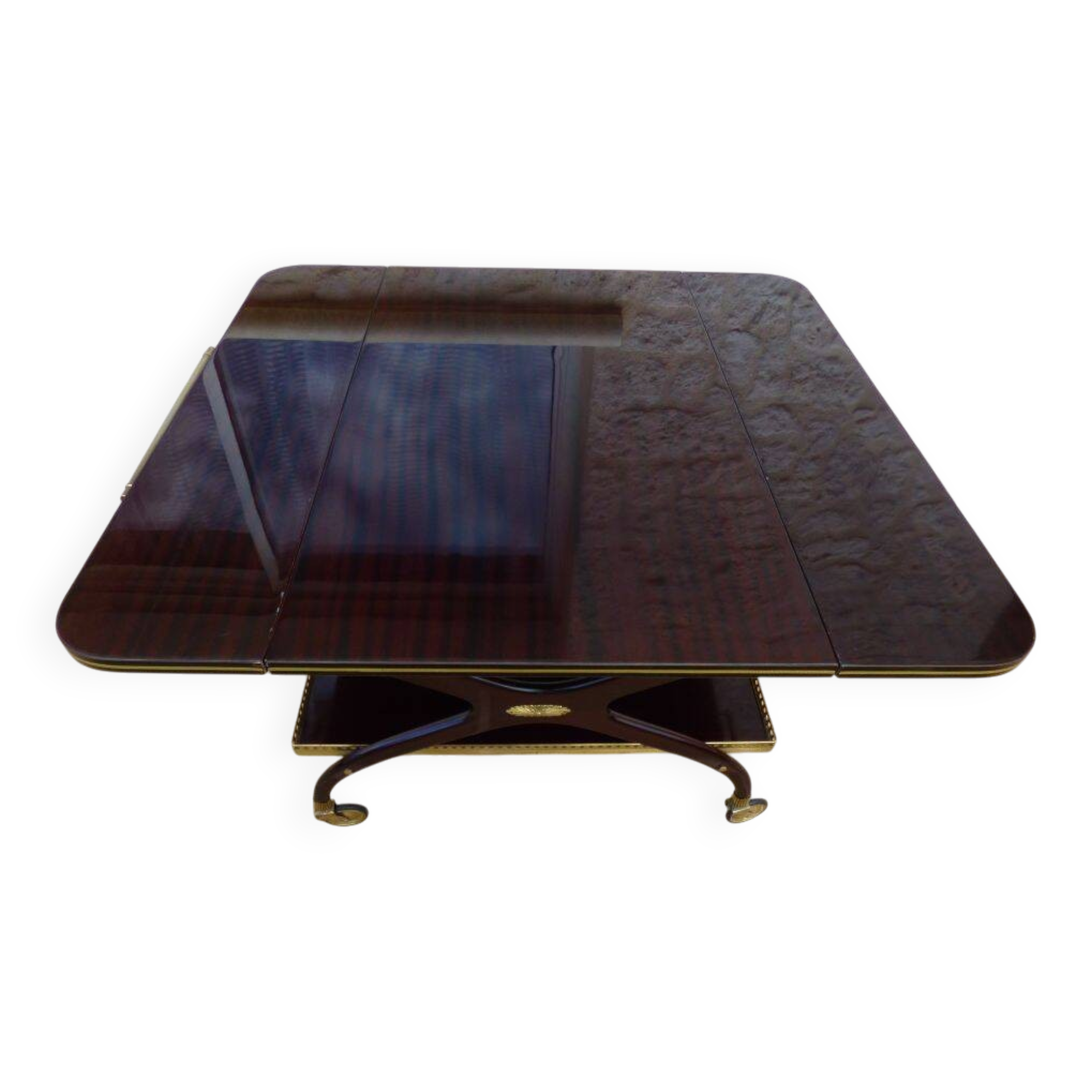 Chic serving table on wheels from the 60s with brass decorations and two shelves.