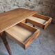 Antique French oak writing desk with 2 lockable drawers, circa 1920.