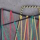 Vintage foldable magazine holder in metal and scoubidou