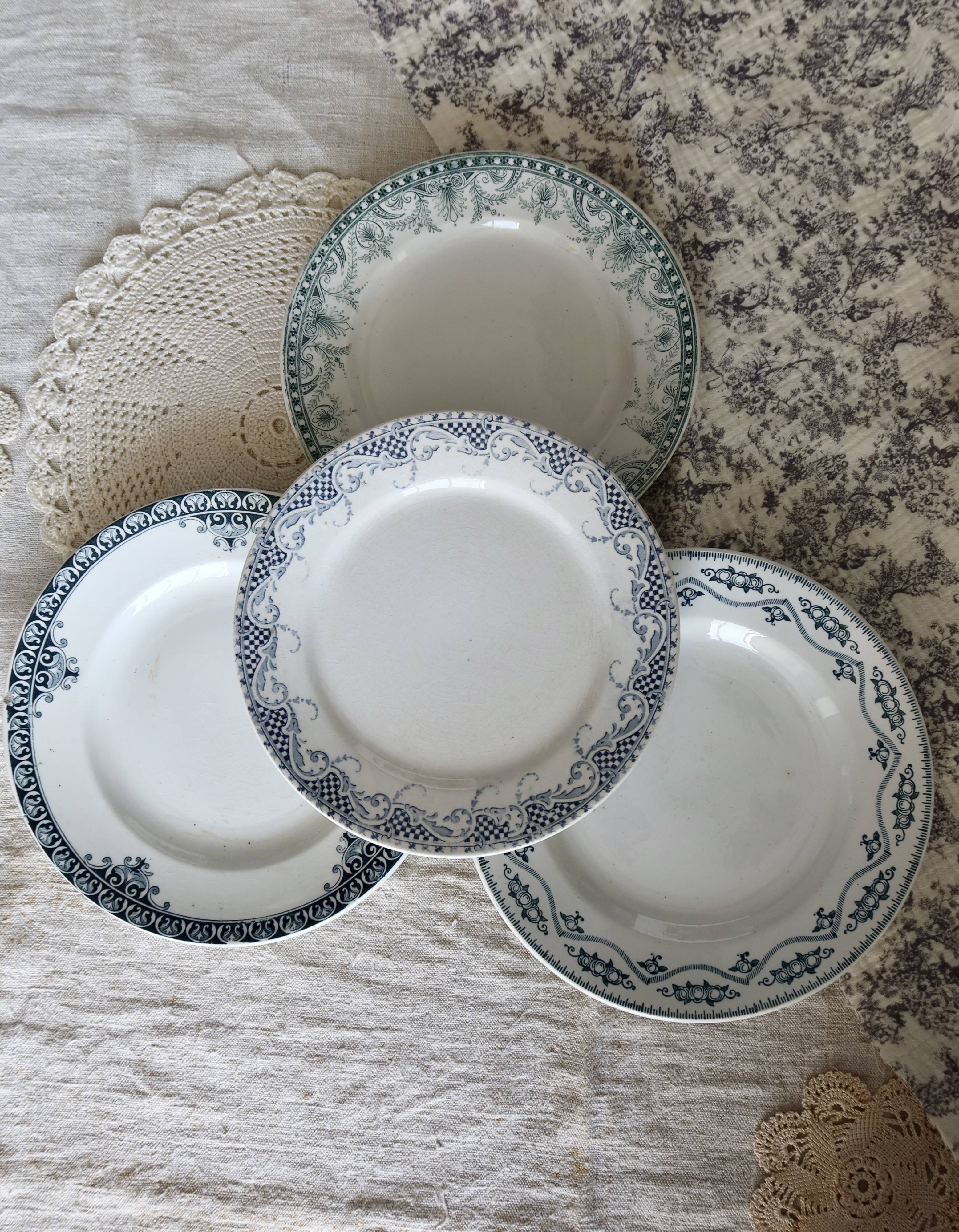 Mismatched vintage flat plates in green and blue ironstone.