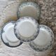 Mismatched vintage flat plates in green and blue ironstone.