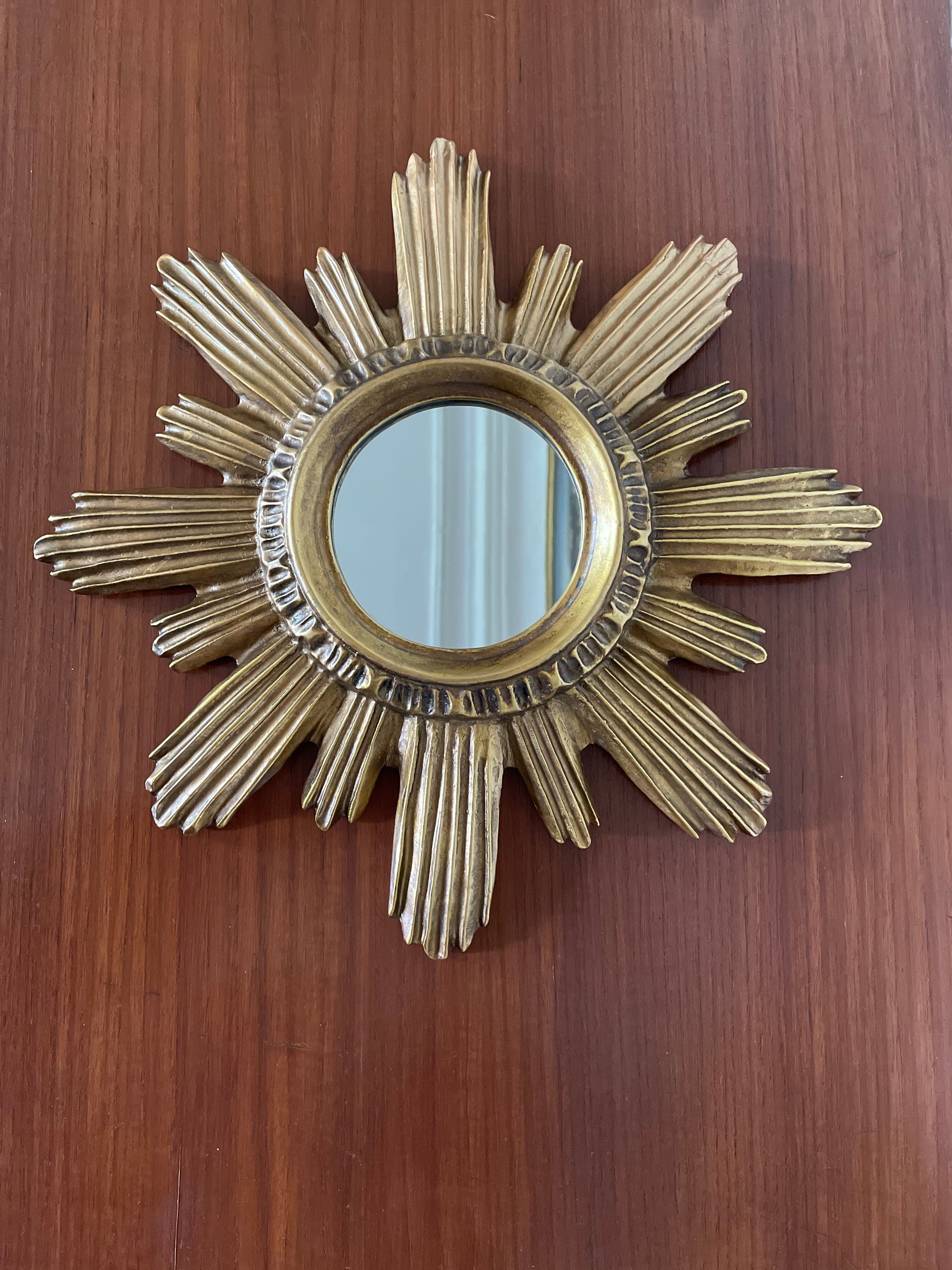 Vintage sun mirror in 60s/70s gold resin