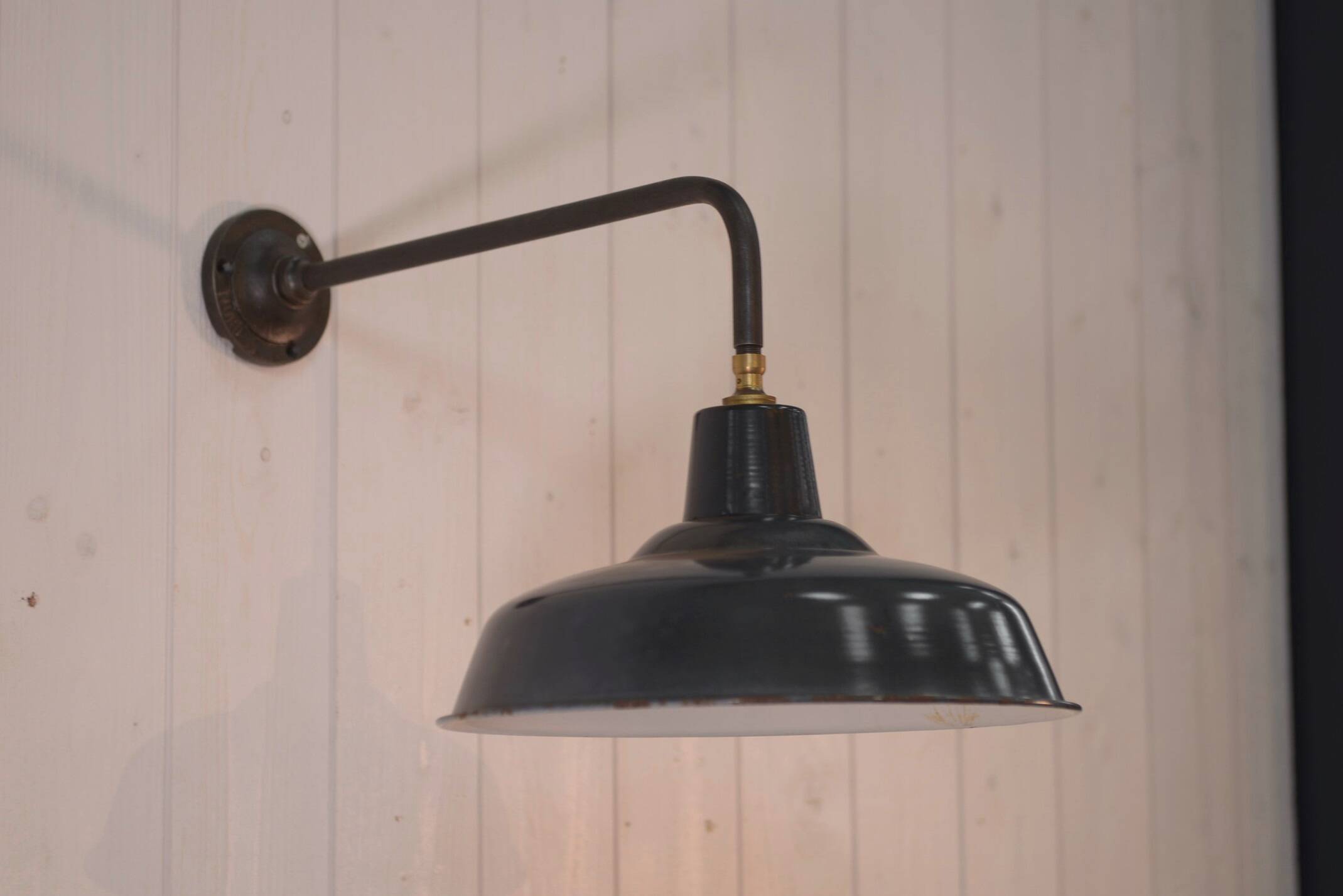 Antique cast iron wall bracket and enamelled globe, 1950s