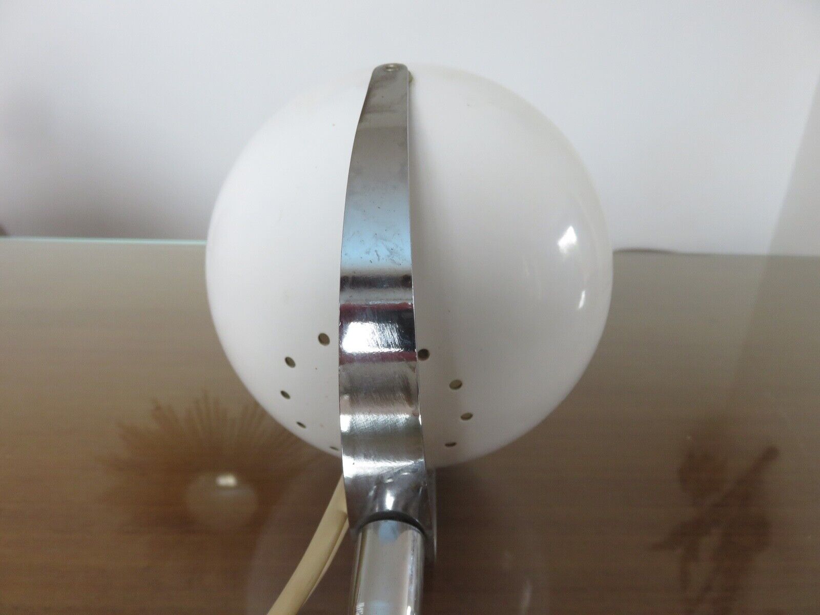 Eye ball lamp stapled on a chrome hose 70s