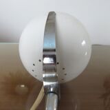 Eye ball lamp stapled on a chrome hose 70s