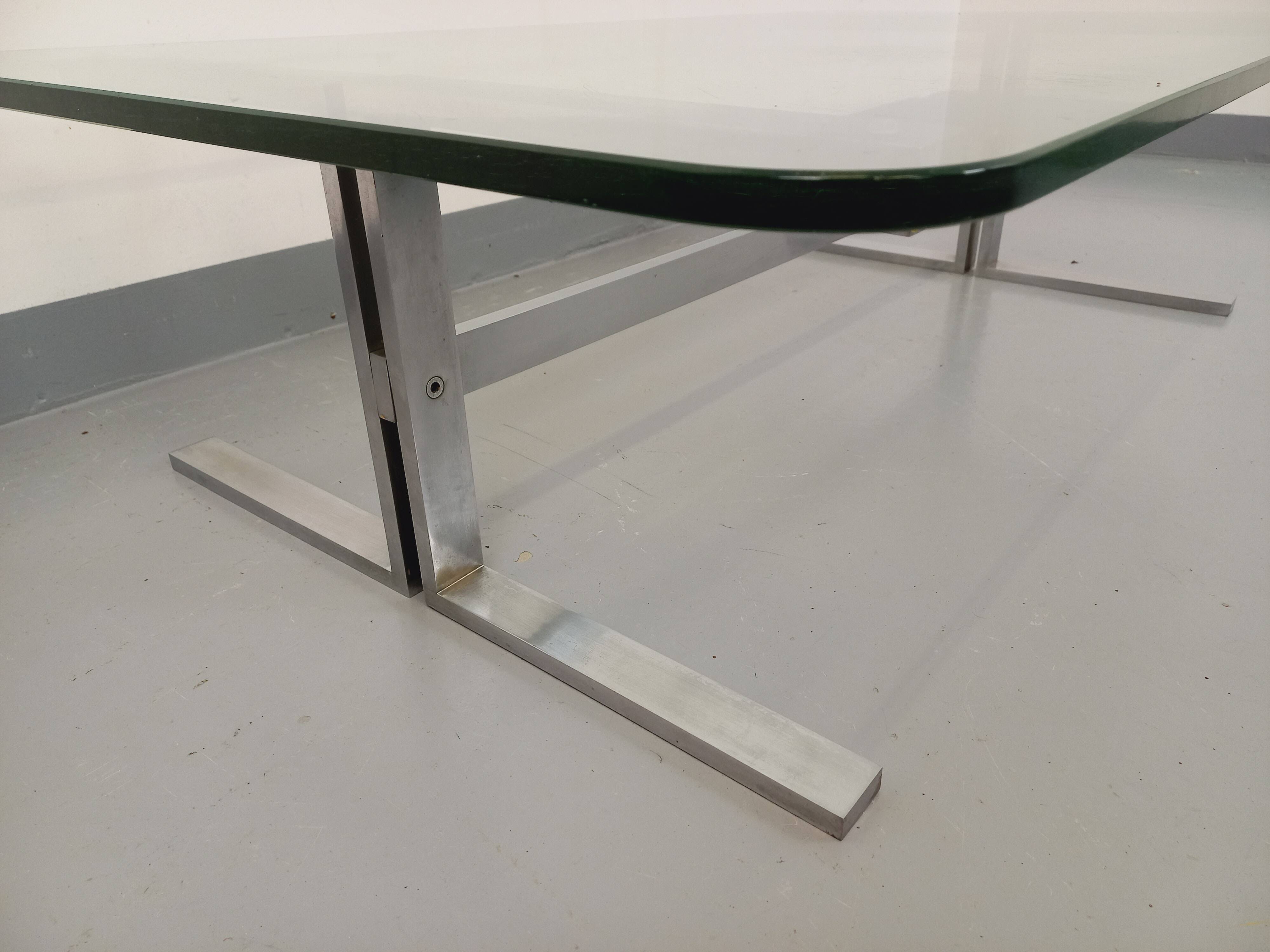 Vintage coffee table in transparent glass and cast aluminum from the 70s