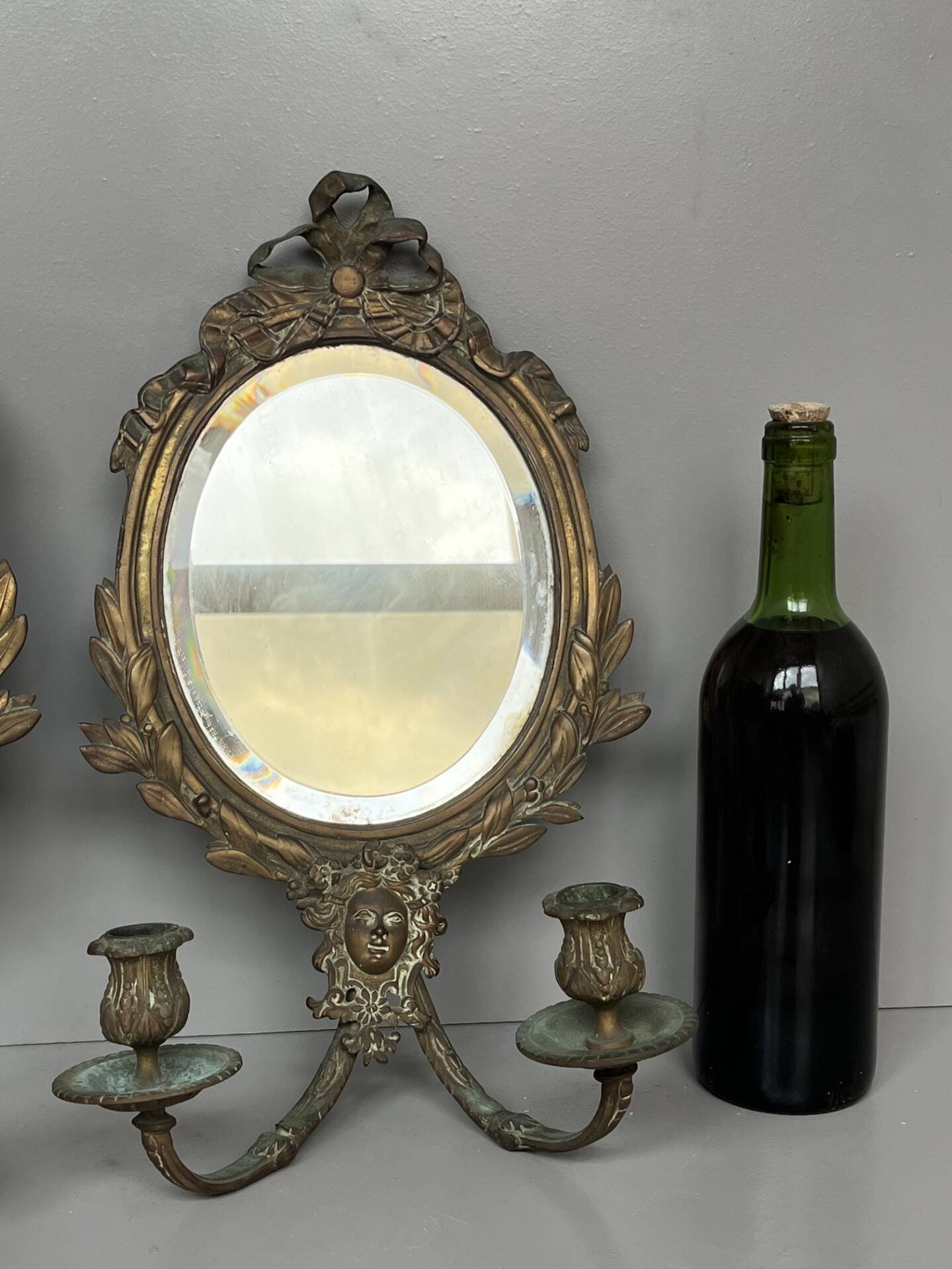 Pair of mirror sconces with bronze candlesticks from the 19th century.