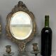 Pair of mirror sconces with bronze candlesticks from the 19th century.