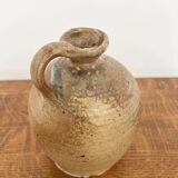 Small antique stoneware jar with handle