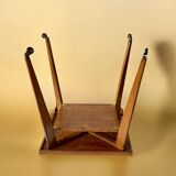 Varnished wooden trolley on wheels