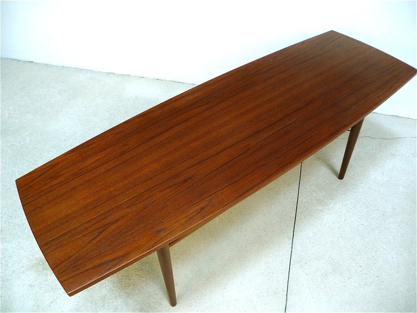 Curved Danish teak coffee table with additional shelf compartment, 1960s