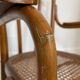 Old thonet armchair in curved wood and rattan cane