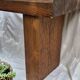 Brutalist wooden bench made of solid oak beam.