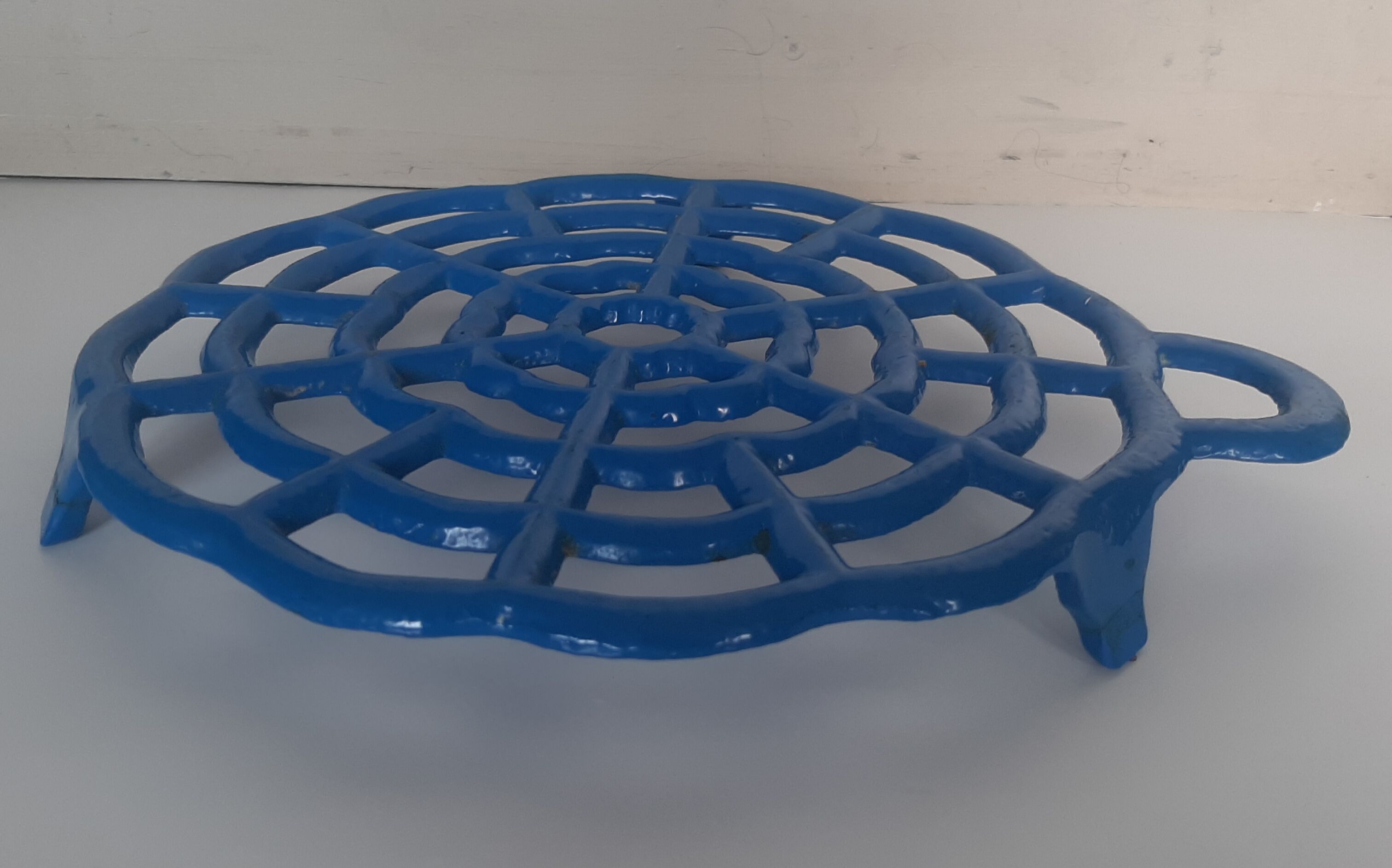 Old blue vintage enamelled table mat