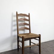 Series of 10 chairs in the style of Charlotte Perriand.