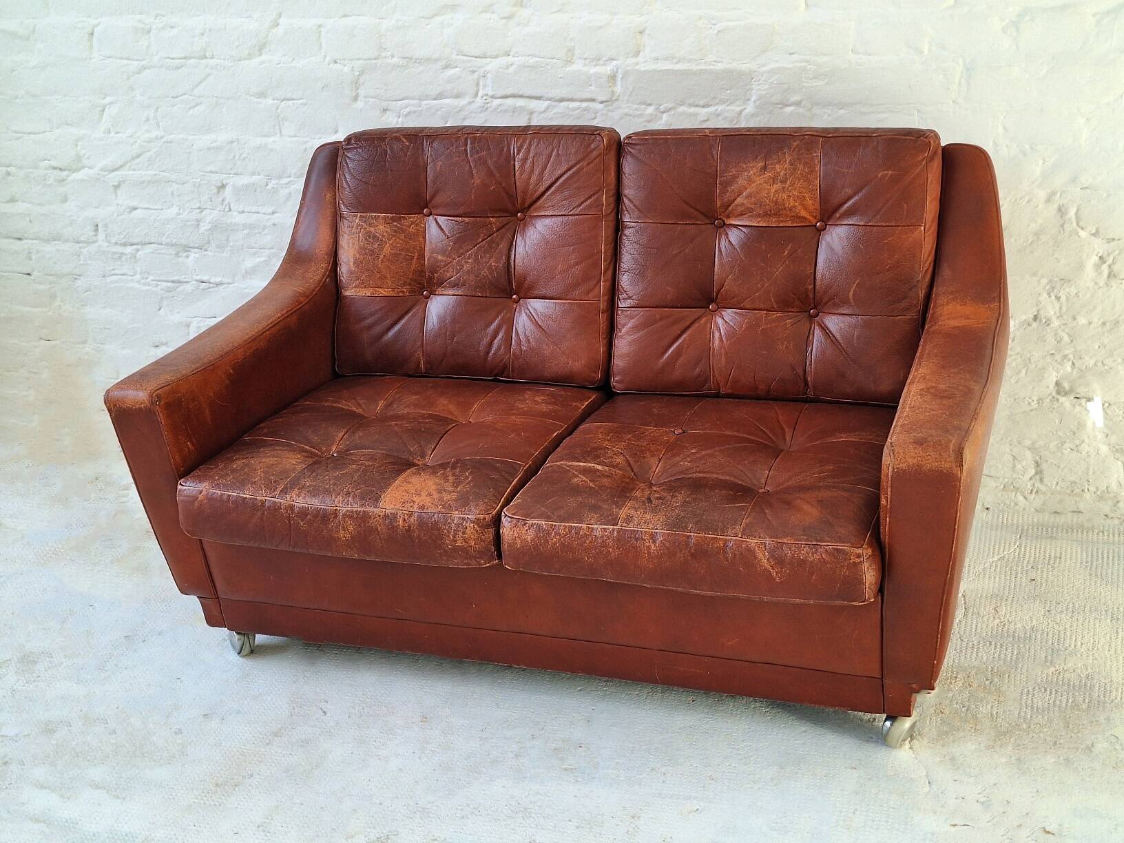 Mid century patchwork tufted patinated leather sofa, 1960s