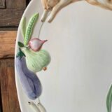 Very large serving dish with hares and vegetables.