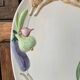 Very large serving dish with hares and vegetables.
