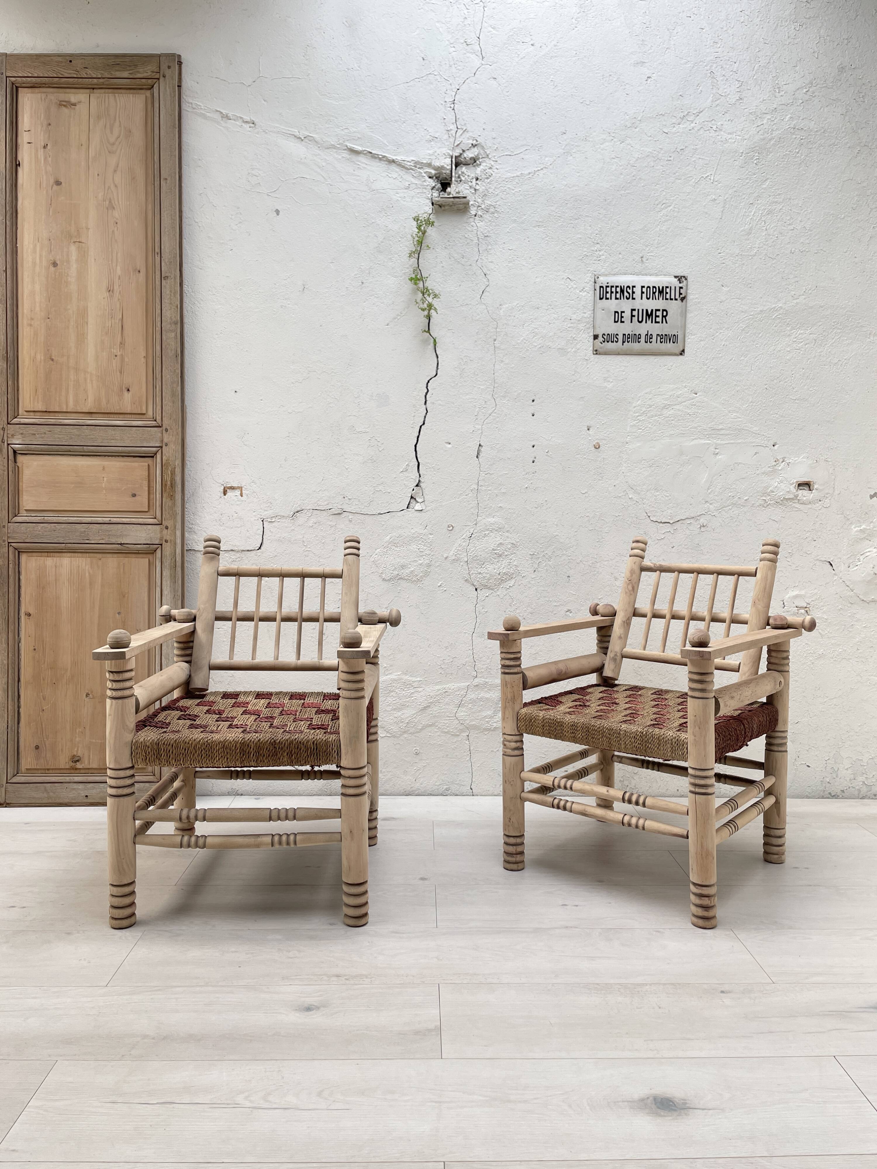 Pair of wooden armchairs and ropes