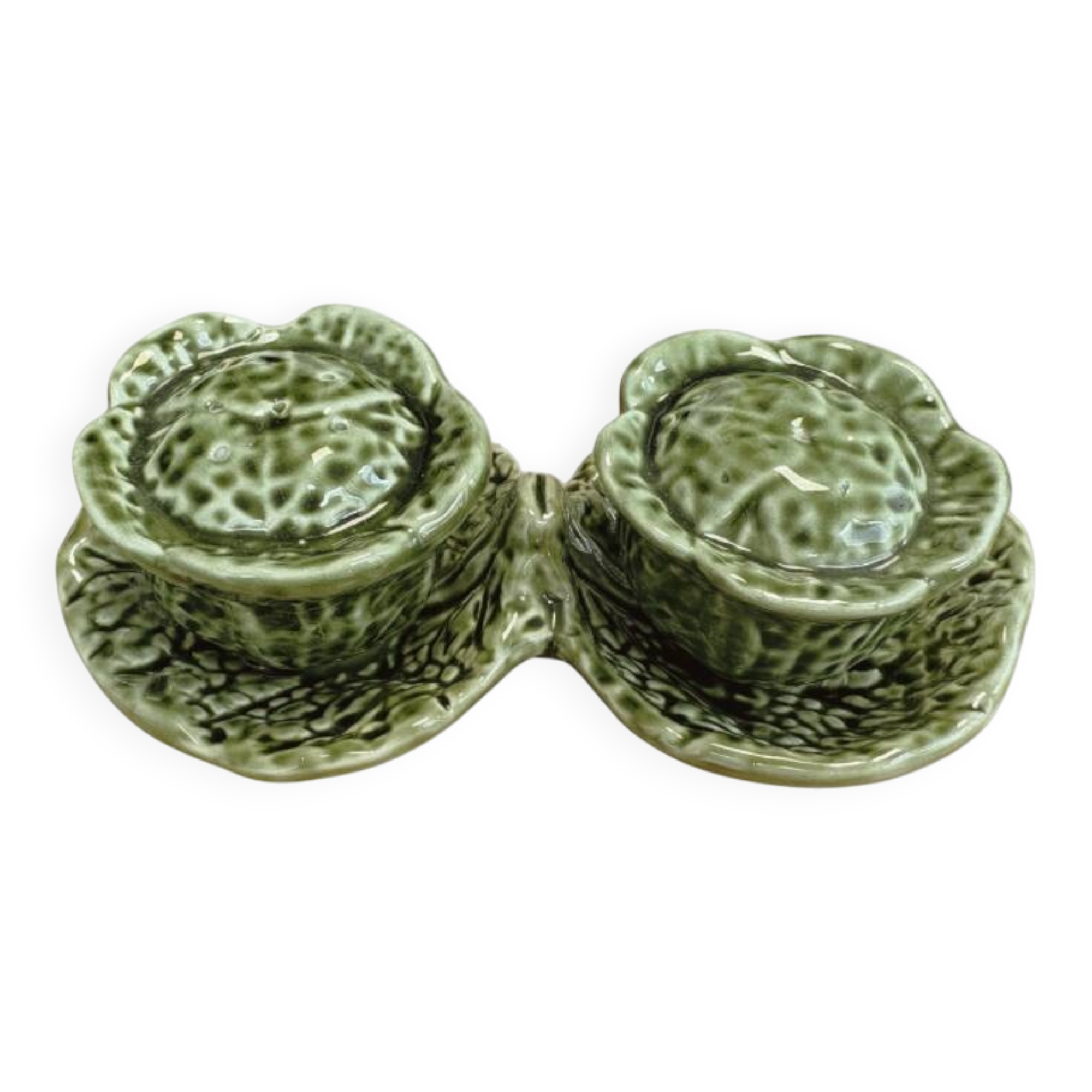 Salt and pepper shakers in the shape of a cabbage leaf.