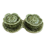 Salt and pepper shakers in the shape of a cabbage leaf.