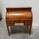 Cylinder desk with marquetry featuring a crosshatch design.