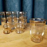 Set of 9 old glasses with golden net