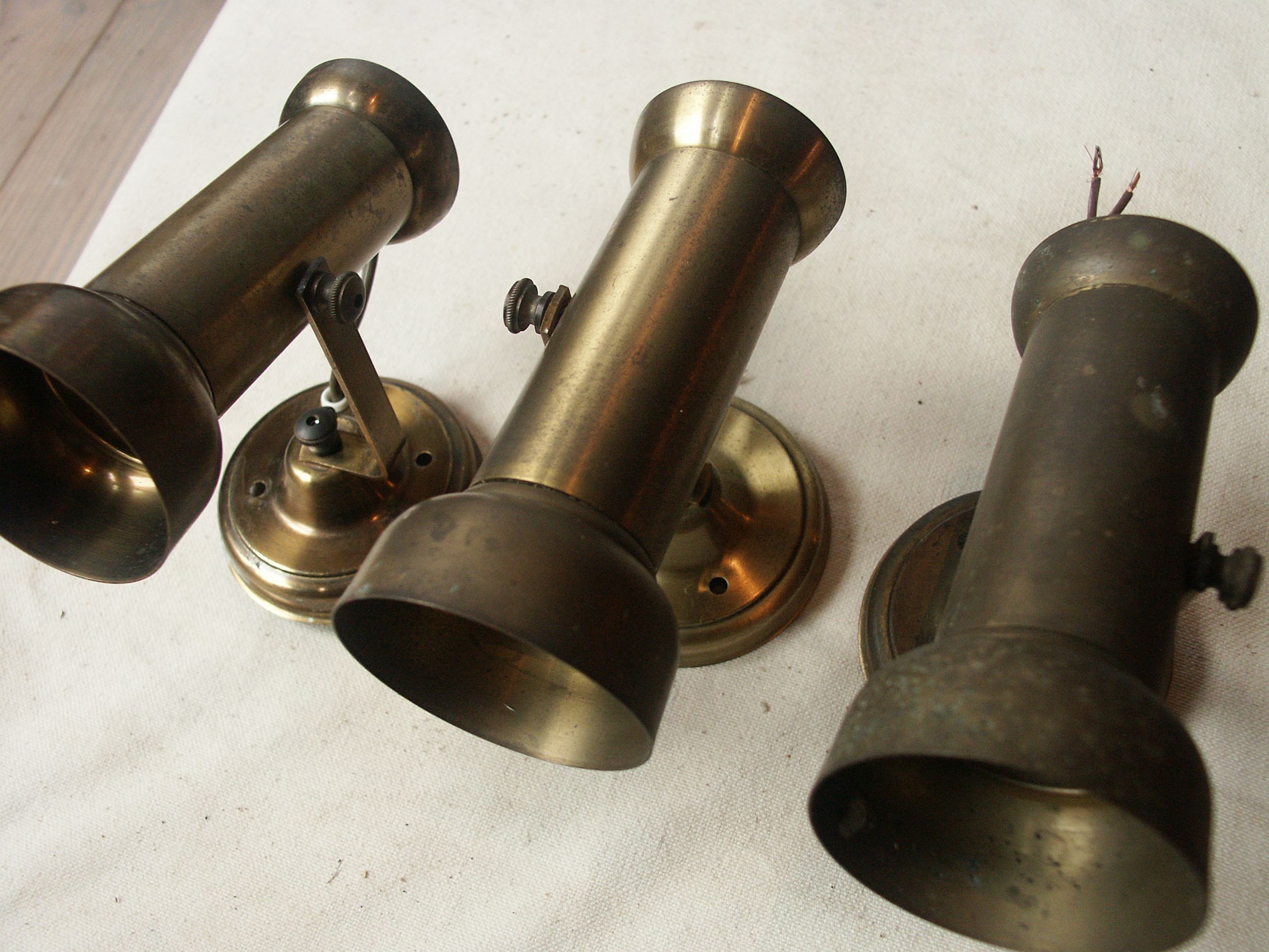 Trio of brass spots year 70