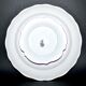 Round plate on pedestal, floral mounted dish, moonlight street lamp.