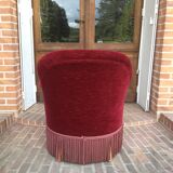 Old toad armchair in red velvet