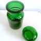 Apothecary jar in vintage green and gold glass
