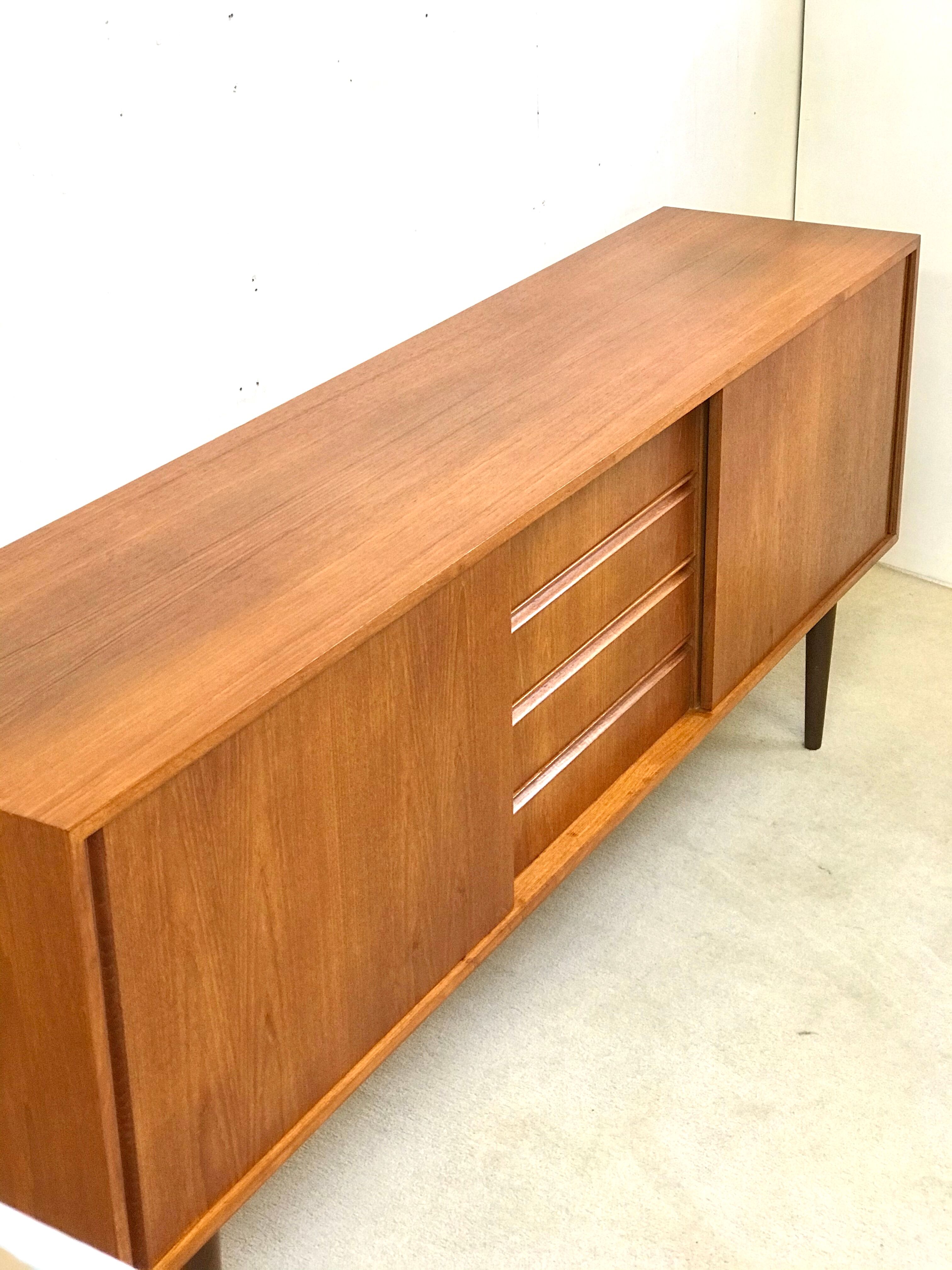 Danish teak sideboard with two sliding doors and 4 central drawers