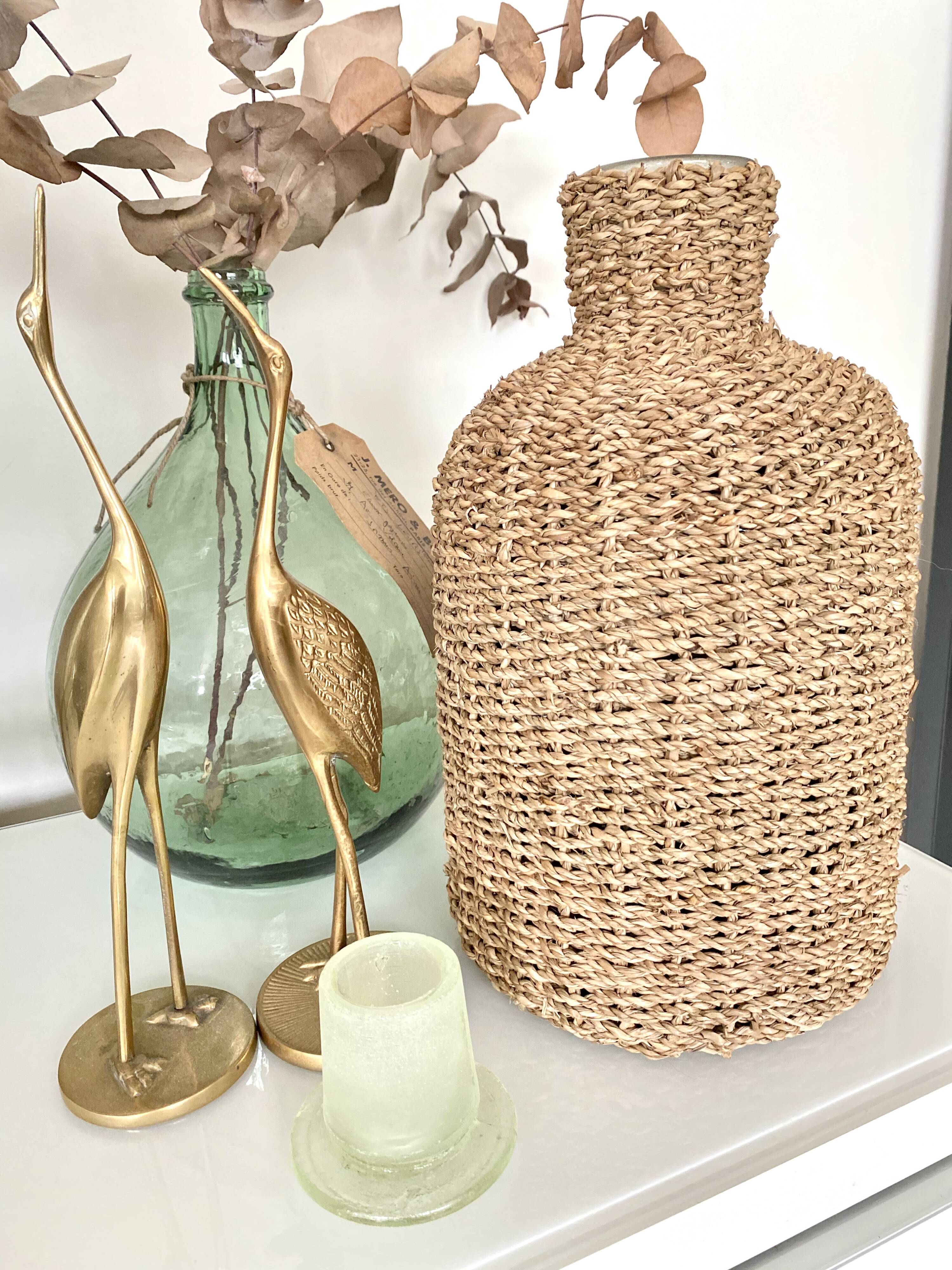 Glass bottle and braided rope