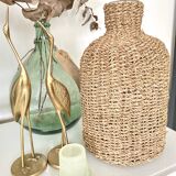 Glass bottle and braided rope