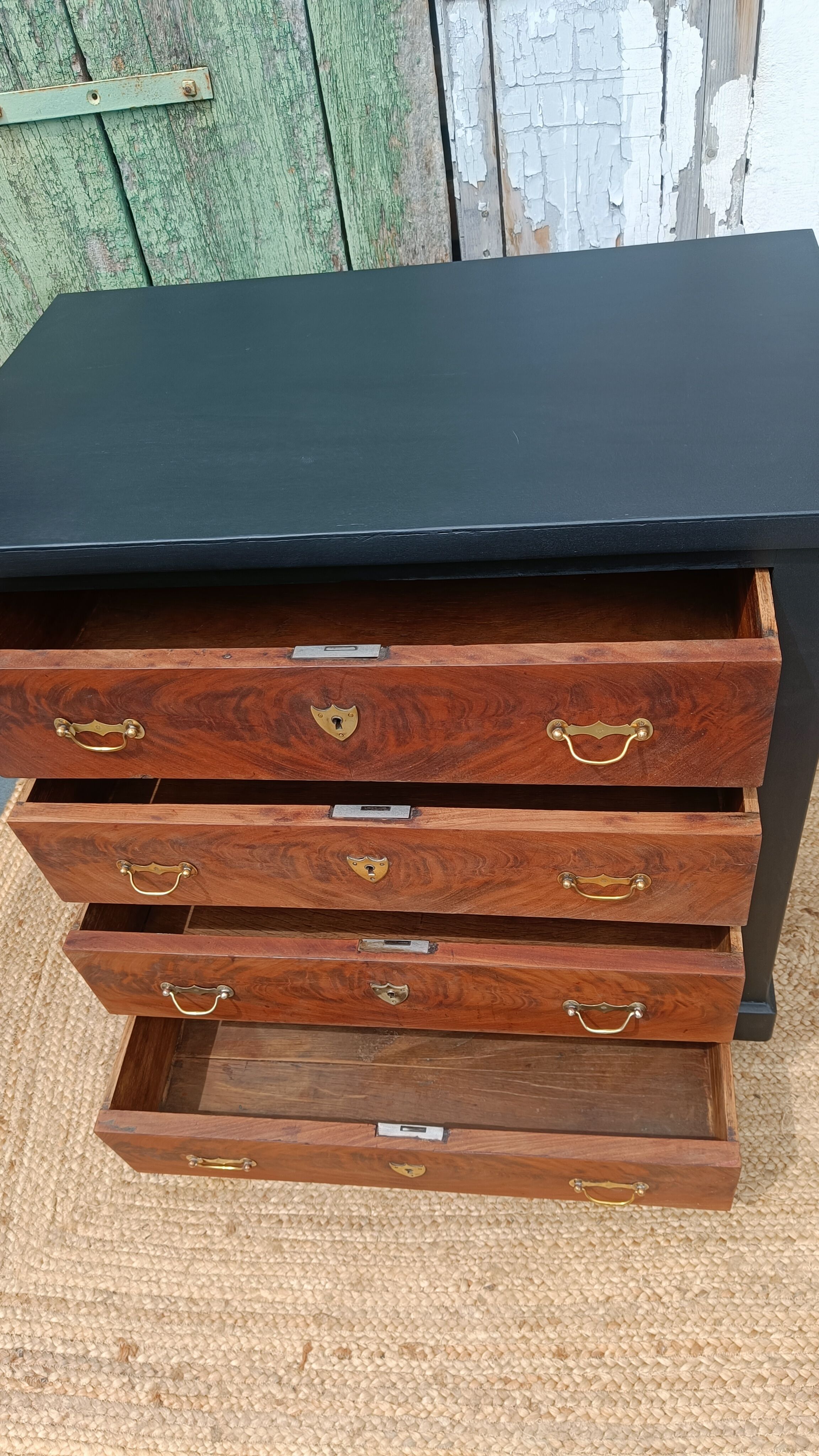 Vintage commode revamped in matte black & wood with warm tones.
