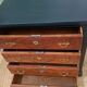 Vintage commode revamped in matte black & wood with warm tones.