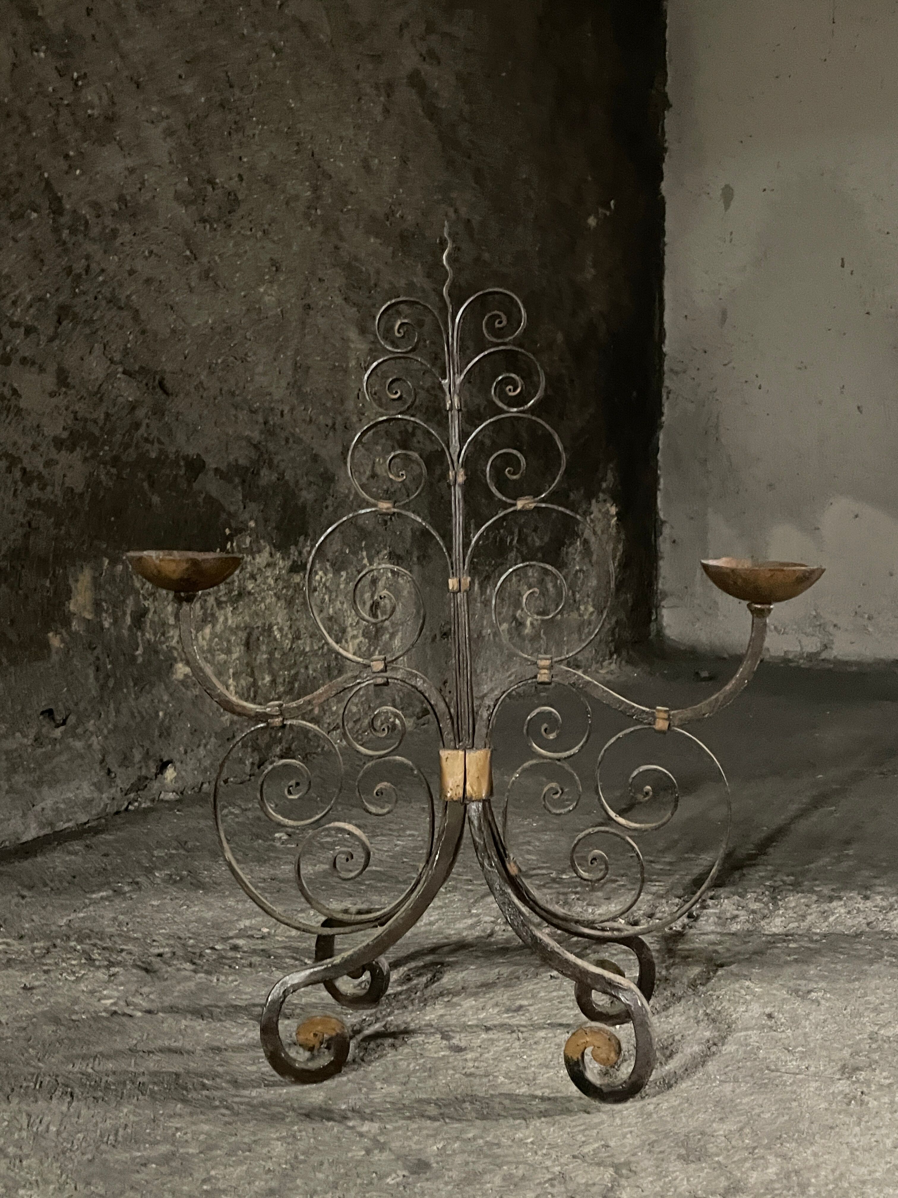 Pair of French wrought iron candelabra from the 19th century.