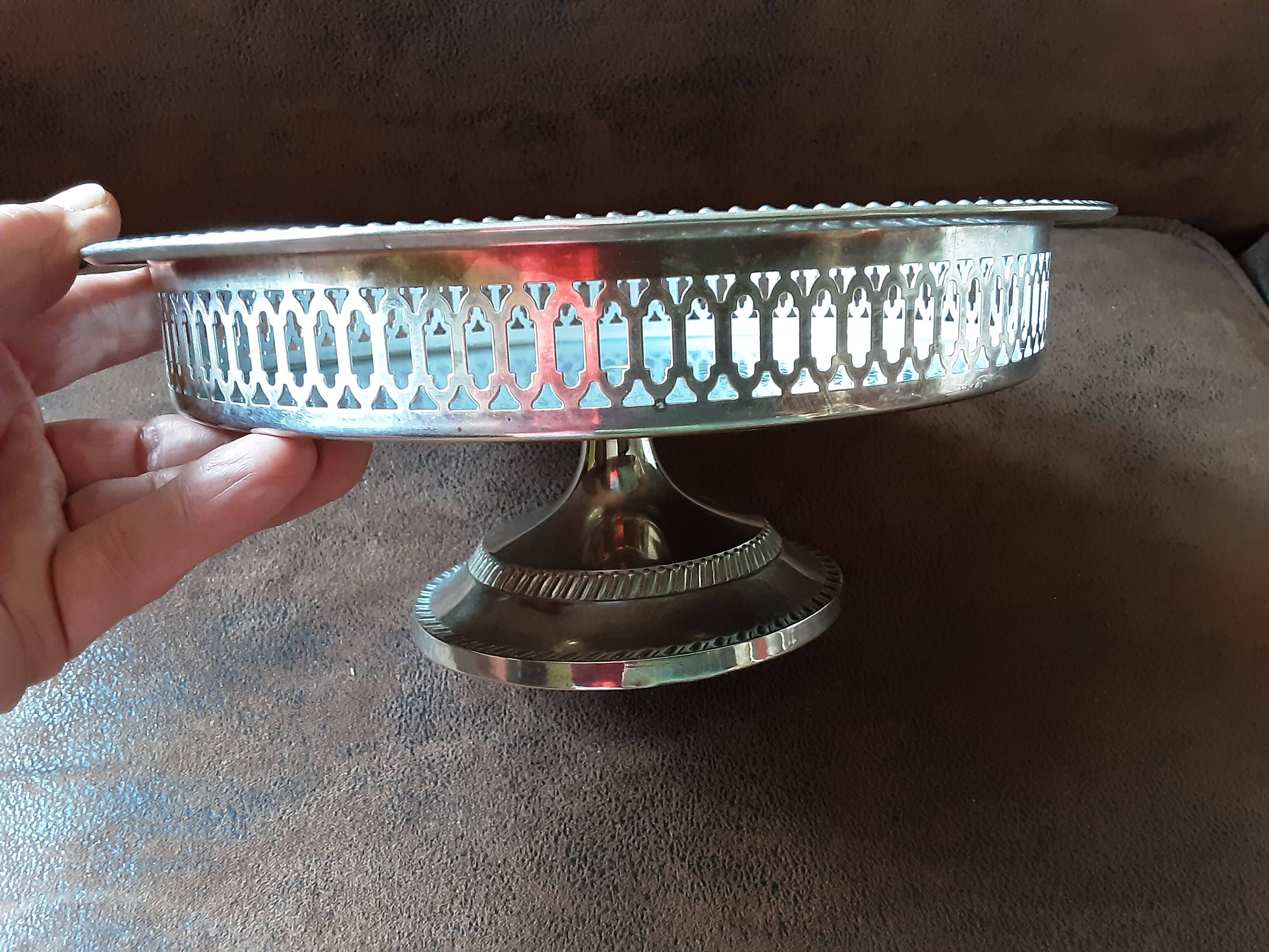 Old metal bowl on foot