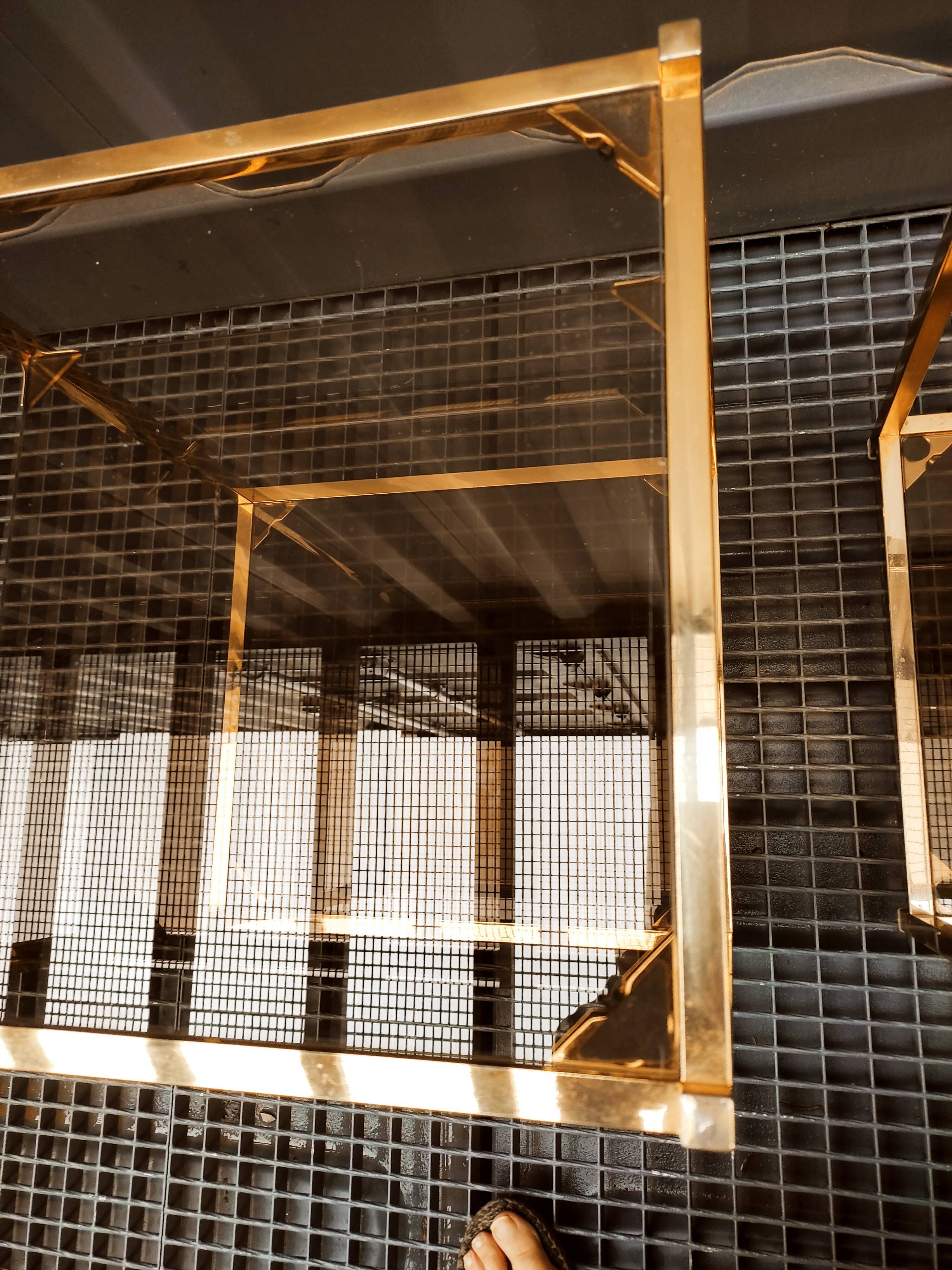 Sofa ends.in gilded metal and glass