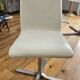 Extendable round table in white formica and 4 matching chairs by Roche Bobois.