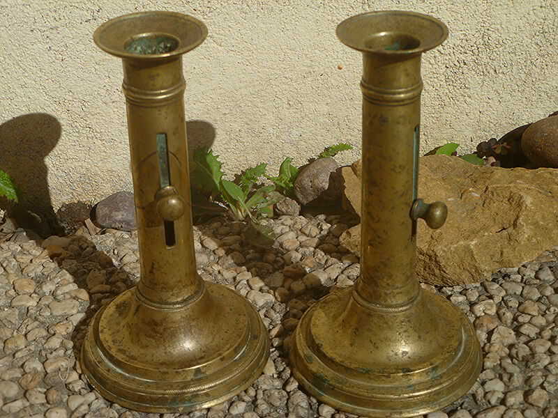 Pair of candlesticks a push brass