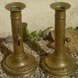 Pair of candlesticks a push brass