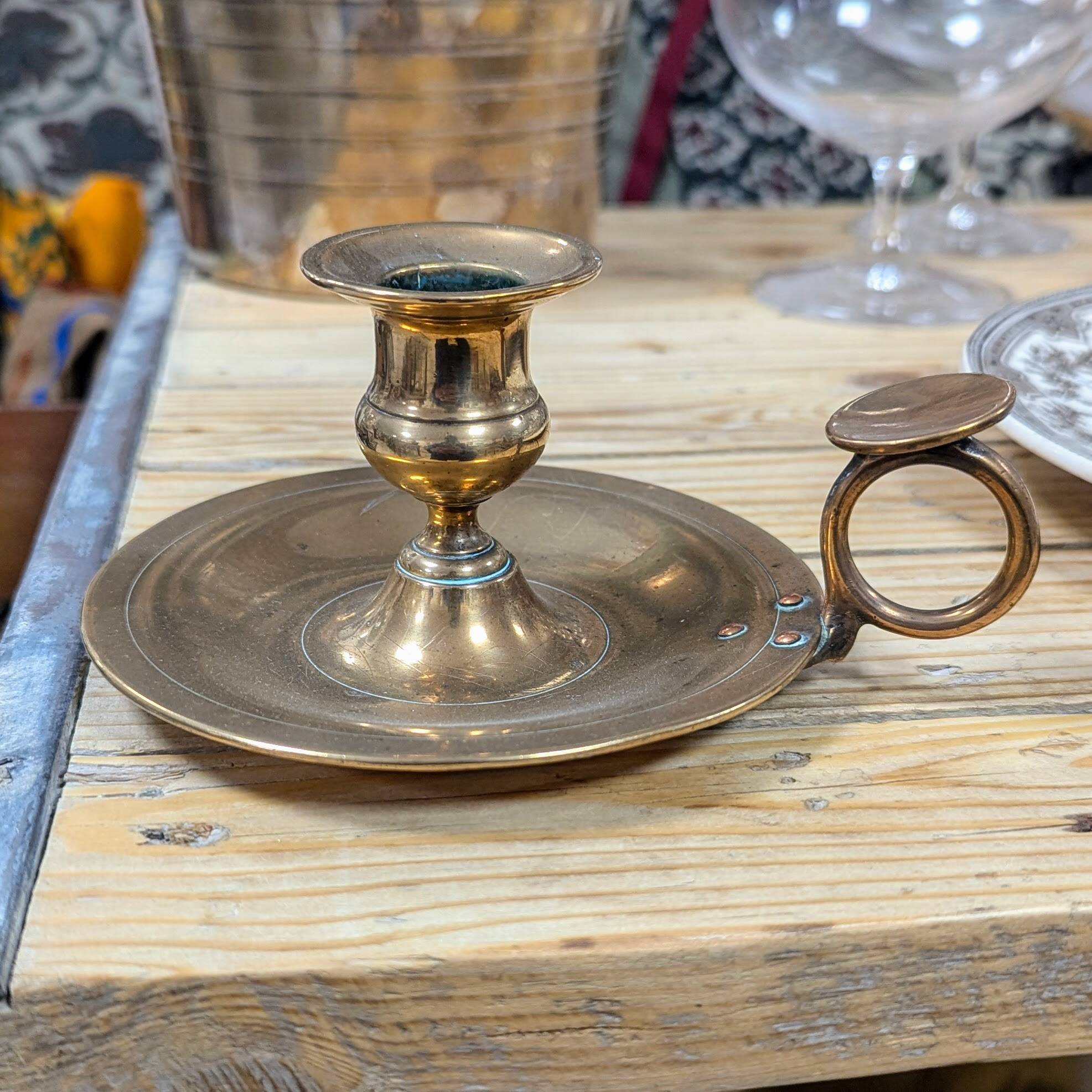 Brass thumb candle holder