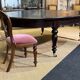 Large English library table in dark walnut with a leather top.