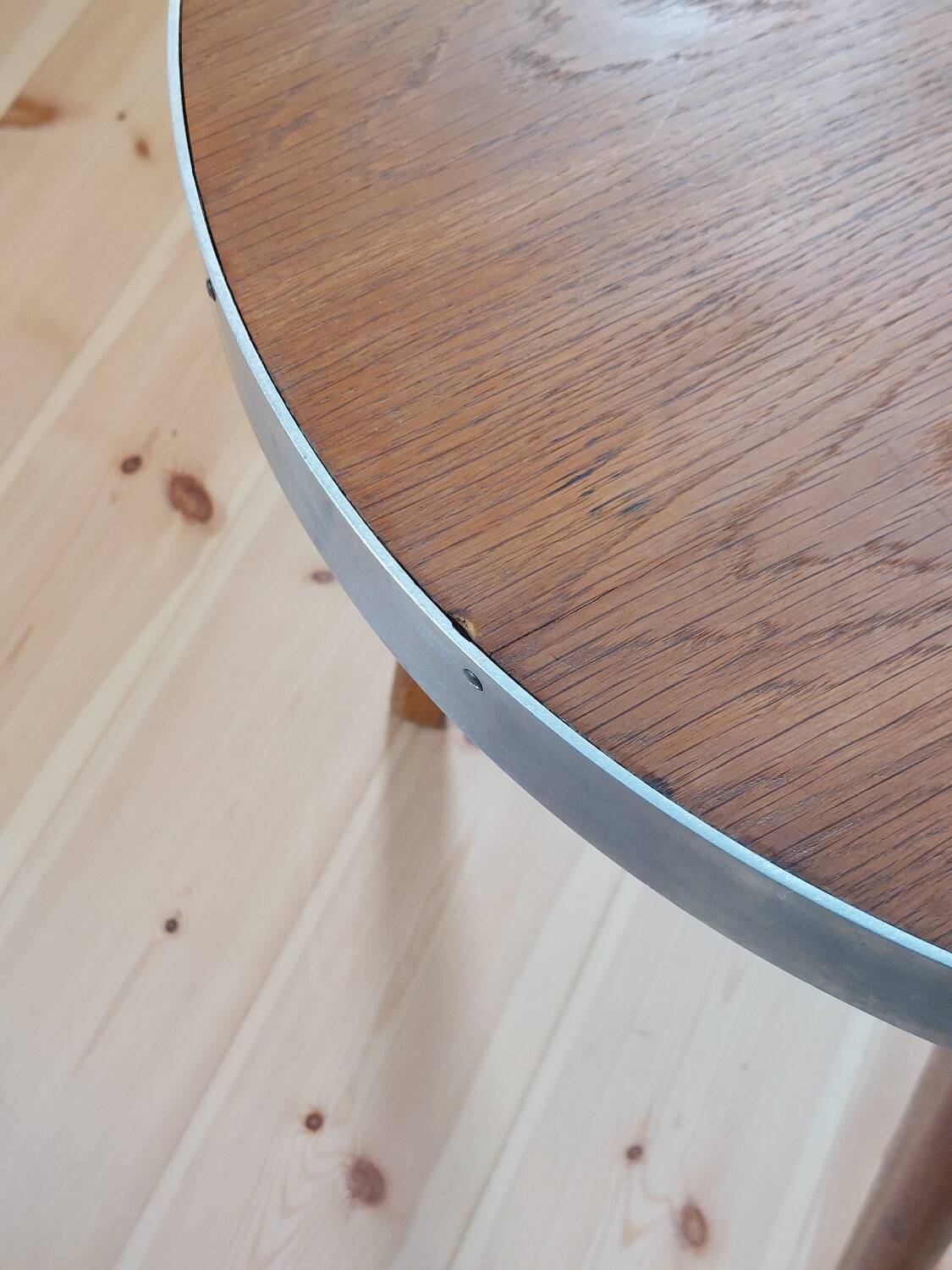 Vintage metal and teak side table from the 1950s.