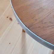 Vintage metal and teak side table from the 1950s.