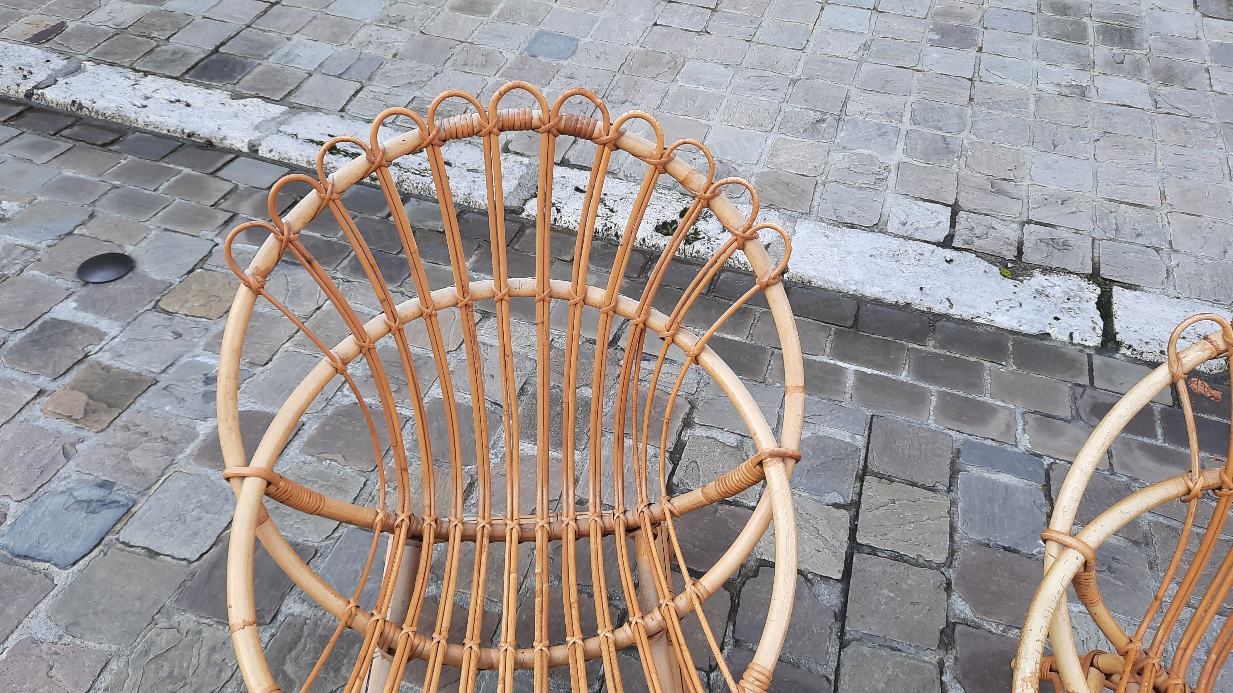 Pairs of shell rattan armchairs from the 50