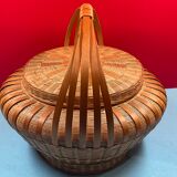 Worker vintage wicker covered basket