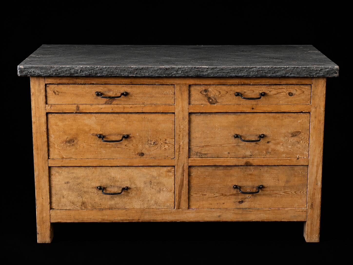 Old wooden workshop furniture with a stone top.